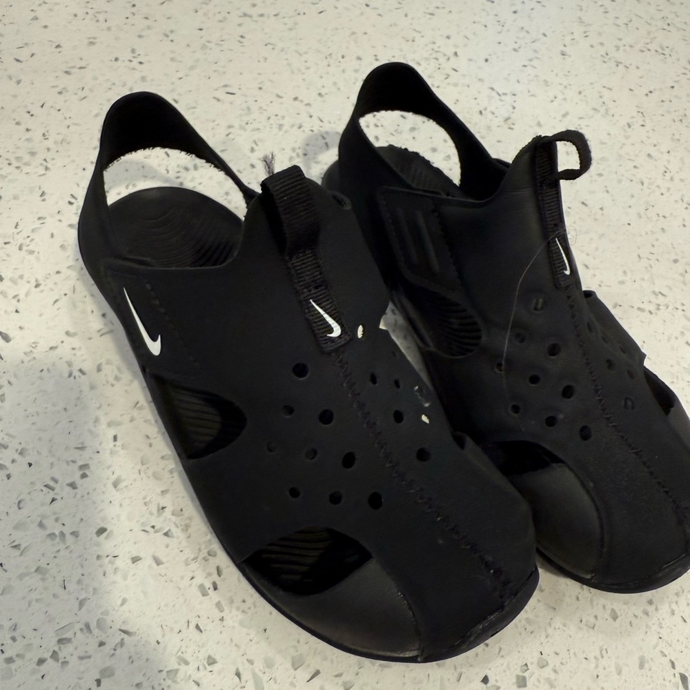 Nike Black Perforated Slip-Ons